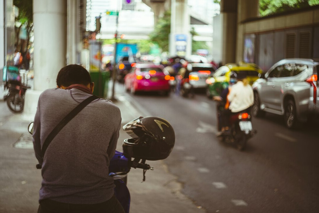 Photographer taking pictures on a city street